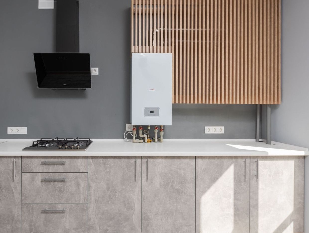 Bright modern kitchen interior design with appliances and cabinetry.